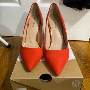 Red pointed toe heels